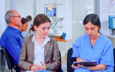 nurse-taking-notes-clipboard-about-patient-dental-problems-waiting-orthodontist-sitting-chair-waiting-room-stomatological-clinic-assistant-explaining-medical-procedure-woman_482257-3674